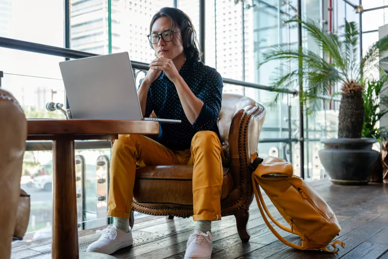 relaxed business man looking at his computer